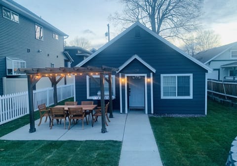 Outdoor area with grill, dining table and firepit