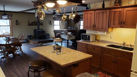 Kitchen looking into dining room and living room