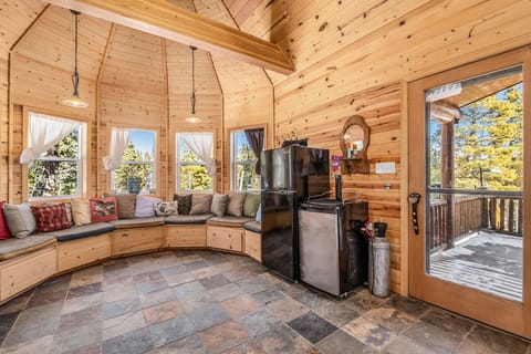 - Unique turret style nook with wraparound bench seating and towering windows