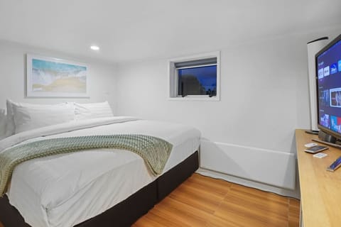 The large bed is a king-size, with crisp white hotel-quality sheets.