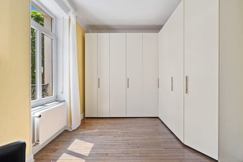 Spacious and serene bedroom with ample storage to keep your belongings organized.