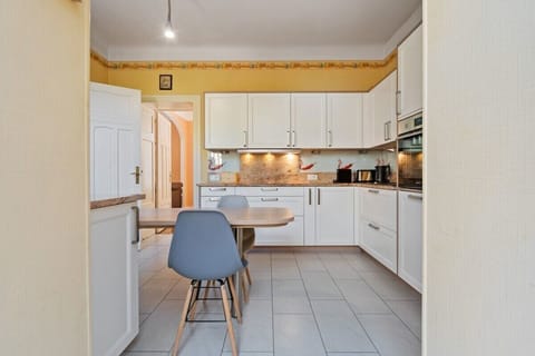 Modern meets function in this well-equipped kitchen, ready for your culinary adventures.