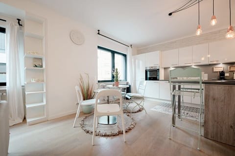 Dining area set up like an outdoor eatery with 2 round cafe tables