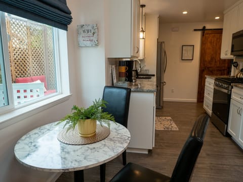 Table to enjoy a meal or serve as a desk if you need to work.