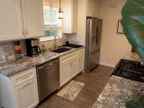 Updated kitchen overlooks your own private backyard