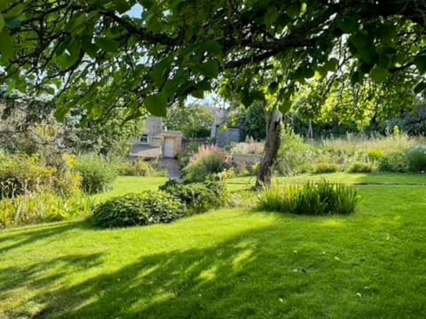 English country garden surrounds the front of the cottage