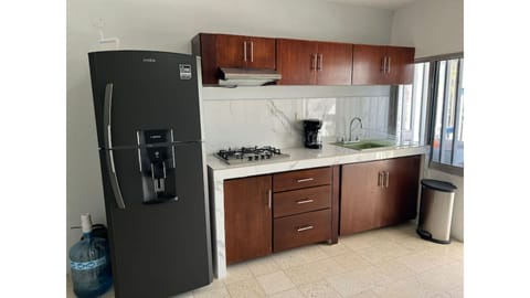 Fridge, oven, coffee/tea maker, cookware/dishes/utensils