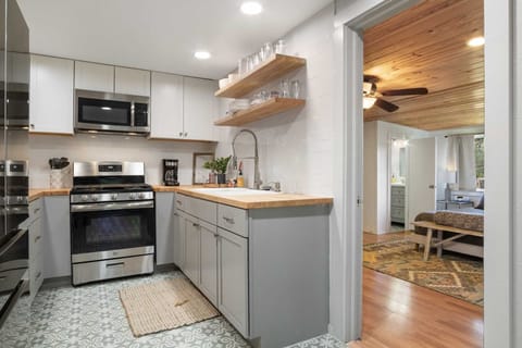 The full kitchen has modern appliances and plenty of cookware and dining ware. All it needs is your culinary creativity!