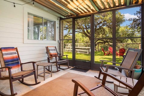 Enjoy a relaxing moment on a rocking chair in the cool breezes of the shaded and screened patio!