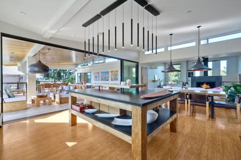 Gourmet kitchen, fully stocked for all your cooking needs and a custom island with a live edge counter and bar seating for 4