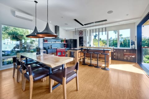 Tastefully decorated dining area with seating for eight. Live edge dinner table and comfortable chairs. All made specifically for the owner.