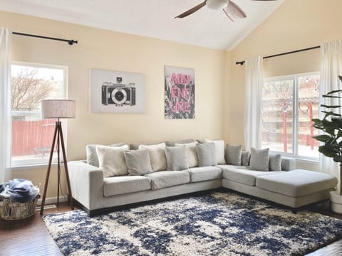 Spacious living room with a large sectional for movie nights and group downtime.