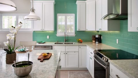Lots of storage and counter space in the beautiful kitchen... (Check out that backsplash!)