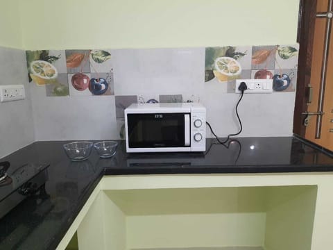 Kitchen with Micowave and Gas Stove