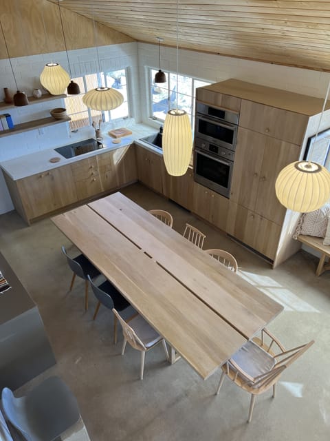 Kitchen with custom white oak 12 person table