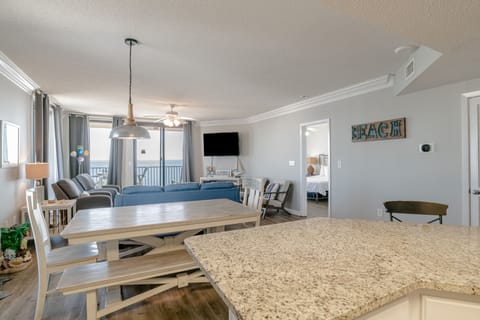 Looking from the kitchen through the dining area and living room to the beach!!
