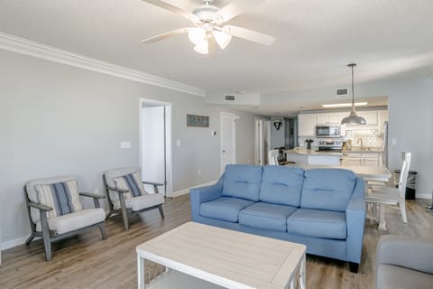 A shot looking from the balcony to through the dining area into the kitchen.