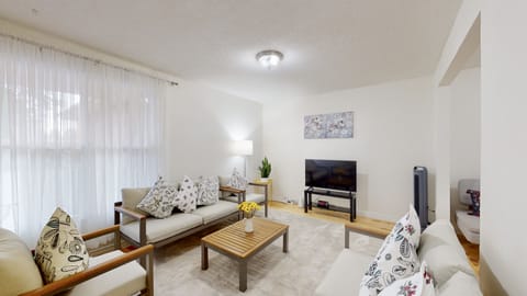 Living Room. Carpet, hardwood.1Loveseat+2single sofa, Large filled with daylight