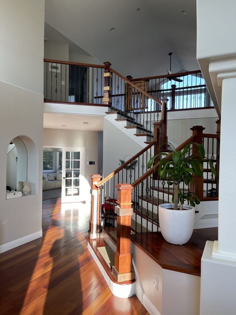 lovely entry way with high ceilings and gorgeous wood floors
