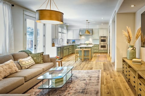 Second living room with 85" smart TV off of kitchen