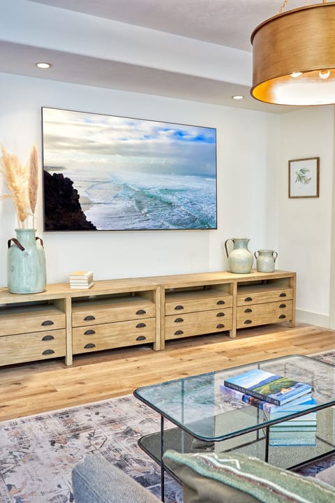 Second living room with 85" smart TV off of kitchen