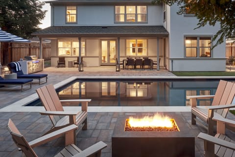 Tranquil backyard w/ heated pool, spa, BBQ & fire pit surrounded by redwoods