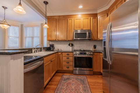 The fully equipped kitchen is designed for effortless meals and memorable moments