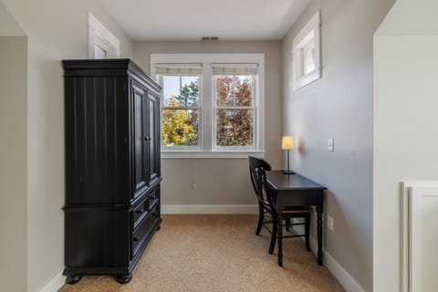 The spacious primary bedroom offers comfort and tranquility for the perfect stay