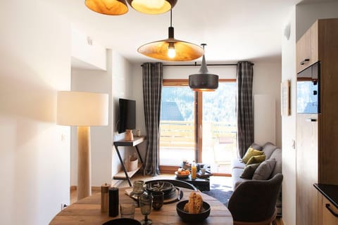 Curl up on the couch and watch a movie in our living area.