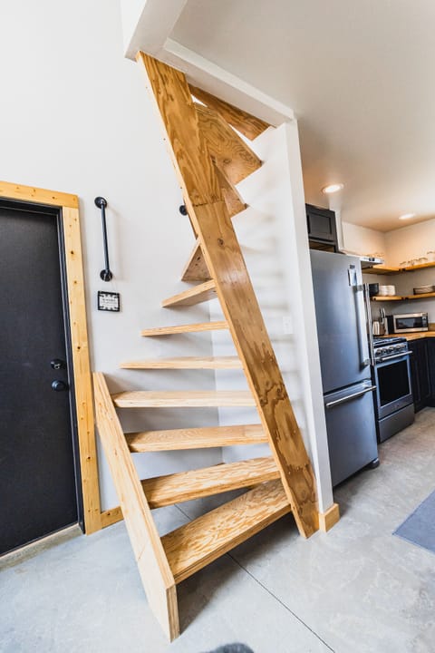 Steep spiral ladder ascends to sleep area with 2 twin beds, NOT easy to ascend.