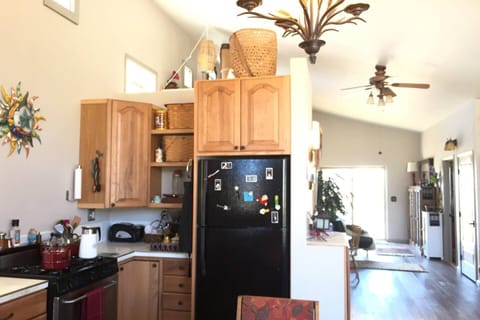 The spacious kitchen opens into the Great Room and Library