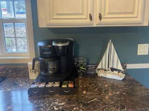 Coffee pot and Keurig machine with Kcups and coffee provided.