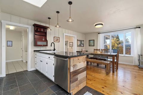 The dining room has a nice garden view, looking out on the front yard and neighborhood.