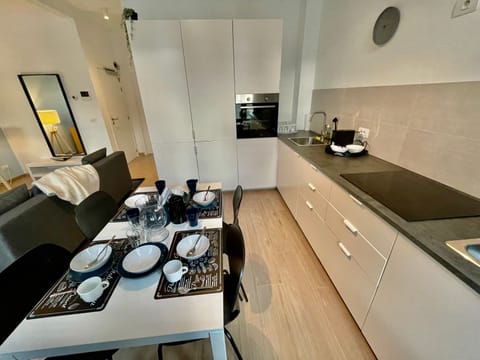 Fridge, oven, dishwasher, dining tables