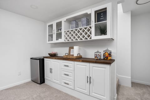 Mix drinks at our dry bar next to the game table and home theater.