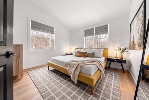 King bedroom — Nectar mattress, premium linens, and room-darkening shades for deep post-adventure sleep.