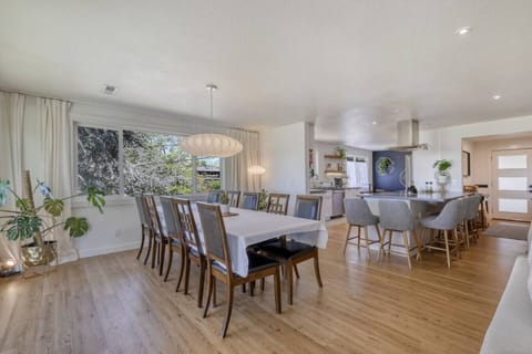 Host the ultimate dinner party in our expansive dining space. Between the large wooden table and the generous kitchen island, there’s comfortable seating for 16, making it the heart of the home for big groups and family meals.