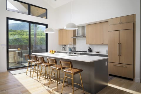 Access the East deck from the kitchen area