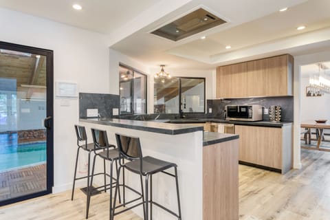 Kitchen with barstool seating.