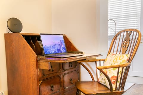 Space to work. Family games and books are in bottom drawer of this desk.