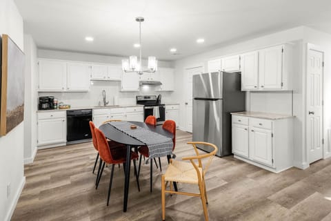 Modern simplicity in a functional kitchen. The interplay of light and shadow creates a sophisticated atmosphere.