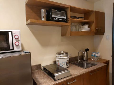 Fridge, microwave, stovetop, coffee/tea maker