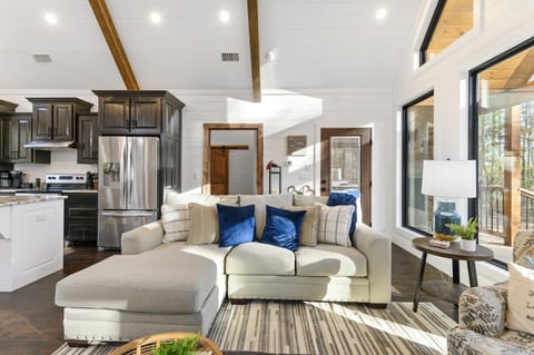 Living Room: Sun-soaked retreat with stylish decor, perfect for relaxation or gathering with friends!