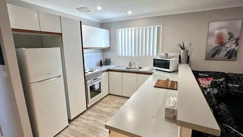 Microwave, dishwasher, dining tables