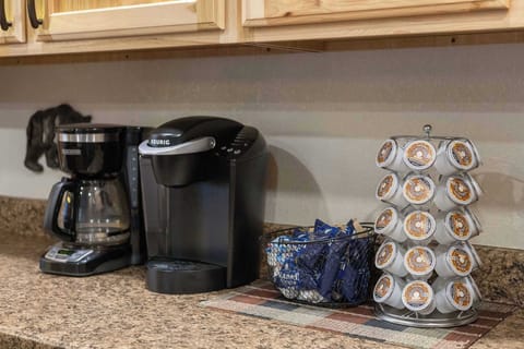 Featuring both a single cup Keurig and a classic drip coffee maker, as well as coffee, cream and sugar. 
