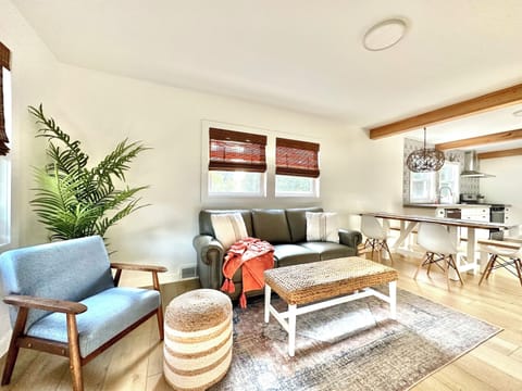 Living Room with plush leather couch and 50" smart tv.