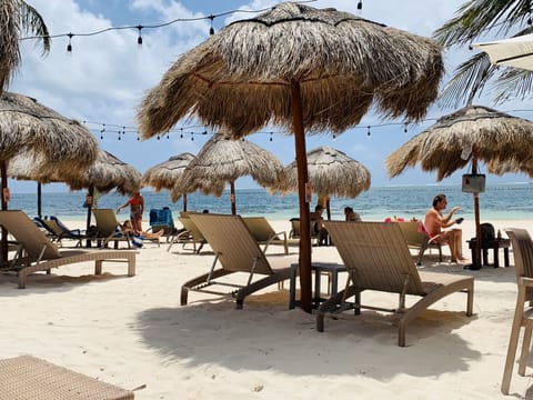 On the beach, sun loungers, beach towels