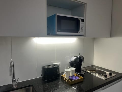 Fridge, microwave, stovetop, coffee/tea maker