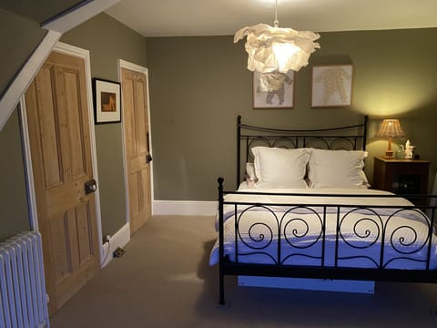 Master bedroom with King size bed and walk in wardrobe