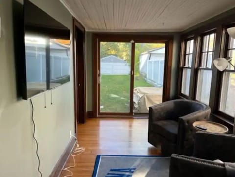 Side porch with large screen and bar.